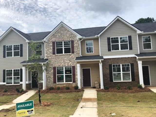 6101 Rockaway Road Atlanta, GA 30349 - Photo 1 of 1 a front view of a house with garage and windows