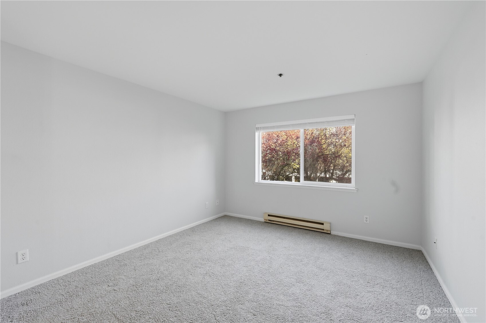 975 Aberdeen Avenue Northeast, Unit F308 Renton, WA 98056 - Photo 18 of 20 an empty room with windows