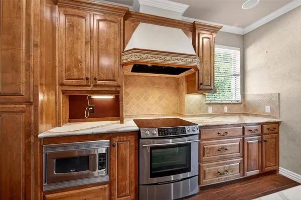 a kitchen with a stove and a microwave