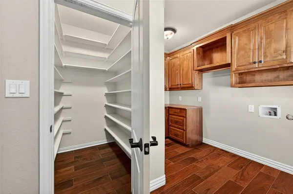 a view of an entryway with wooden floor