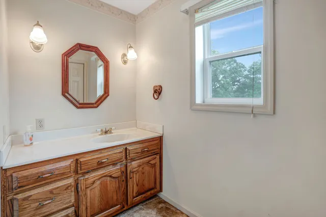 a bathroom with a sink and a mirror
