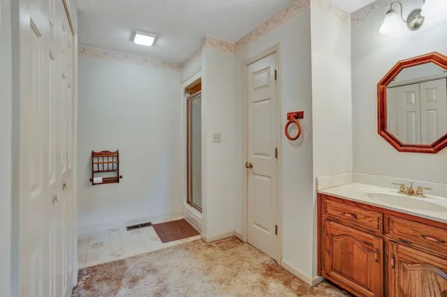 a view of an empty room with a window