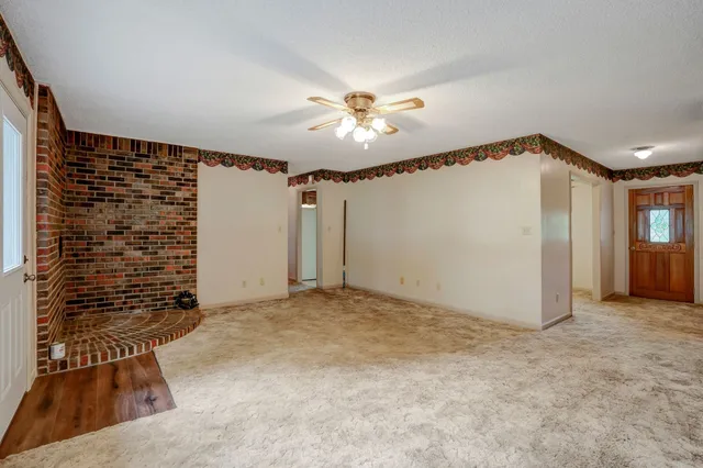 a kitchen with a stove sink and cabinets