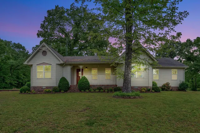 a kitchen with a stove a refrigerator and a sink