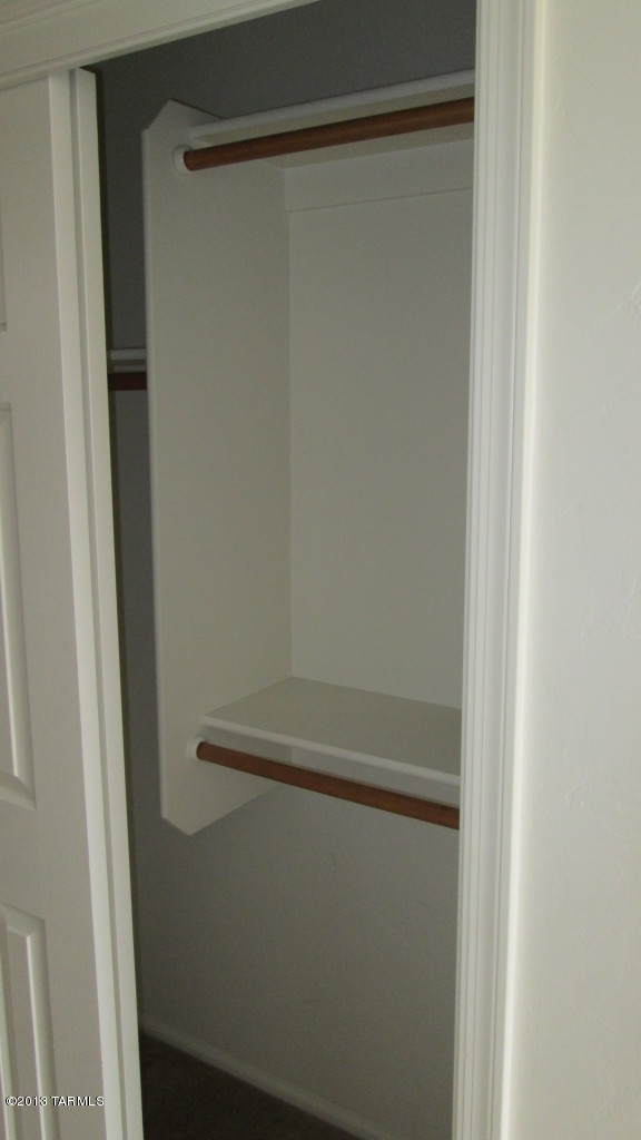 10855 East New Rock Ridge Drive Vail, AZ 85641 - Photo 18 of 34 a close up view of racks on the wall