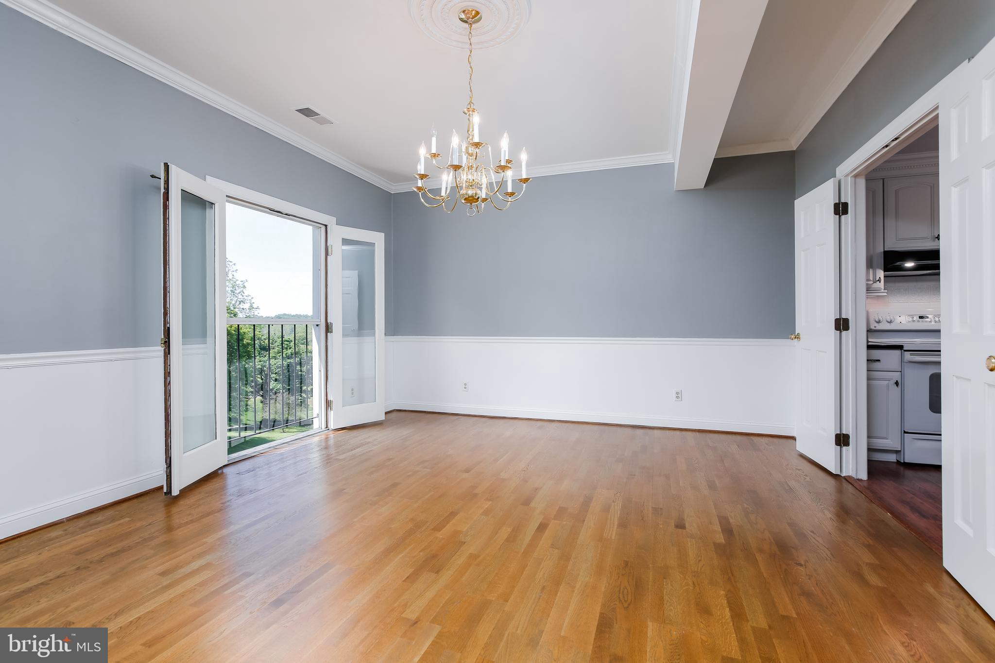 9 Devon Hill Road, Unit B3 Baltimore, MD 21210 - Photo 11 of 44 Dining room French doors open to a beautiful view