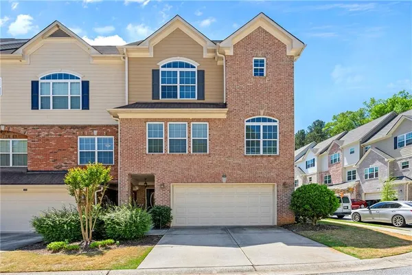 a front view of a house with a yard