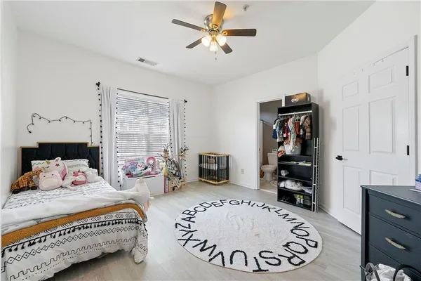 a bedroom with furniture and a fireplace