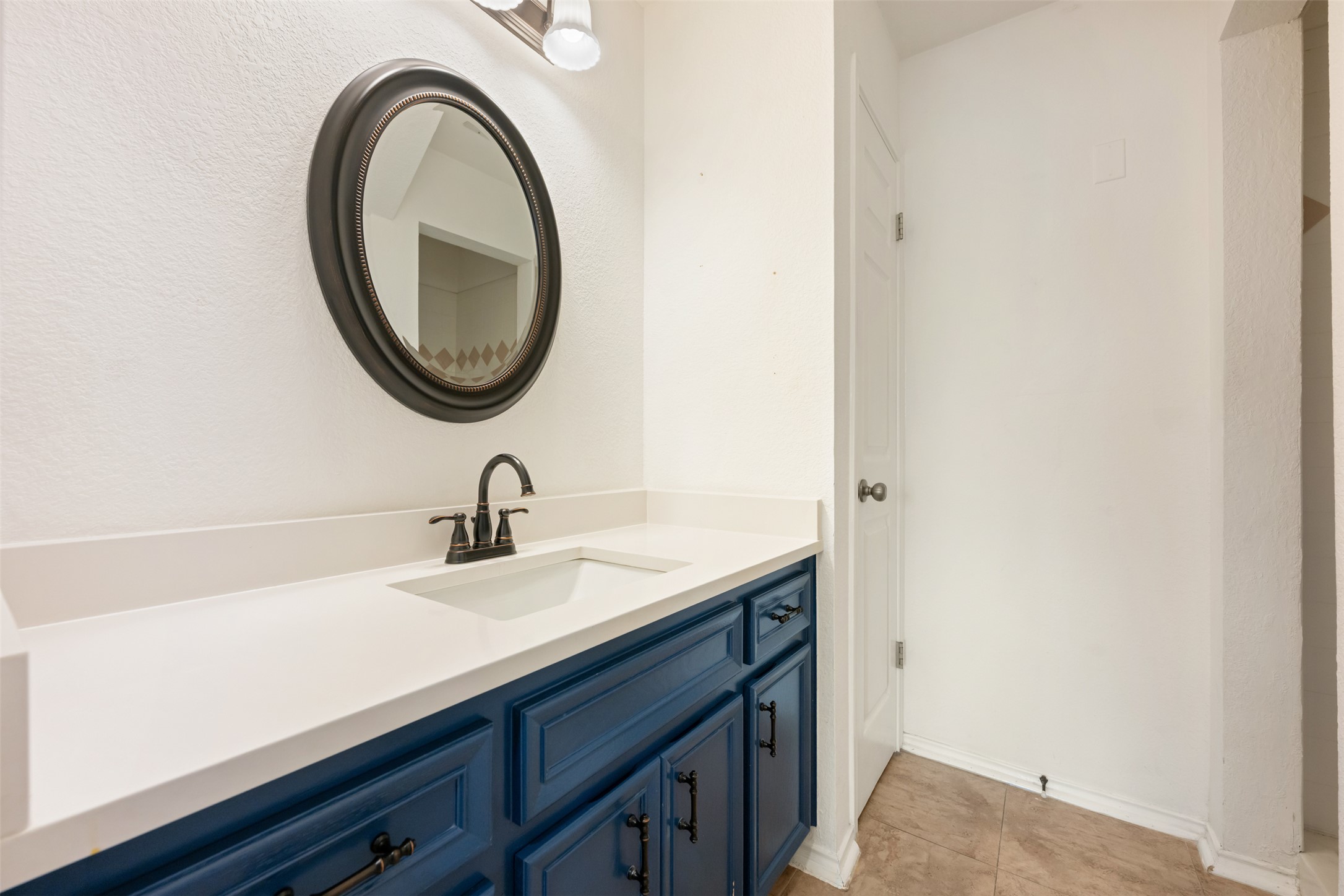 104 Sunset Road Georgetown, TX 78633 - Photo 11 of 40 a bathroom with a sink and a mirror