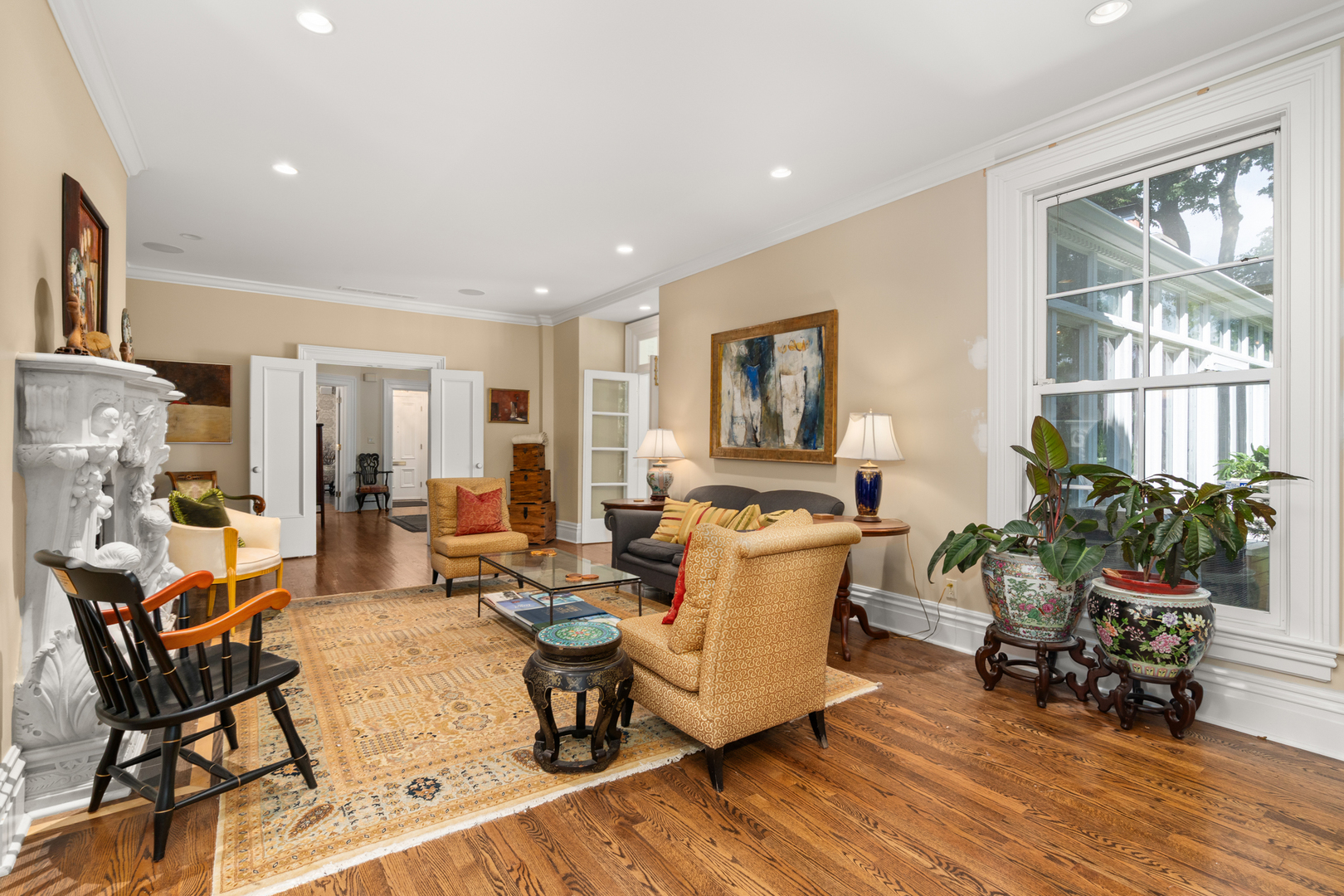 201 Scottswood Road Riverside, IL 60546 - Photo 16 of 32 a living room with fireplace furniture and a wooden floor