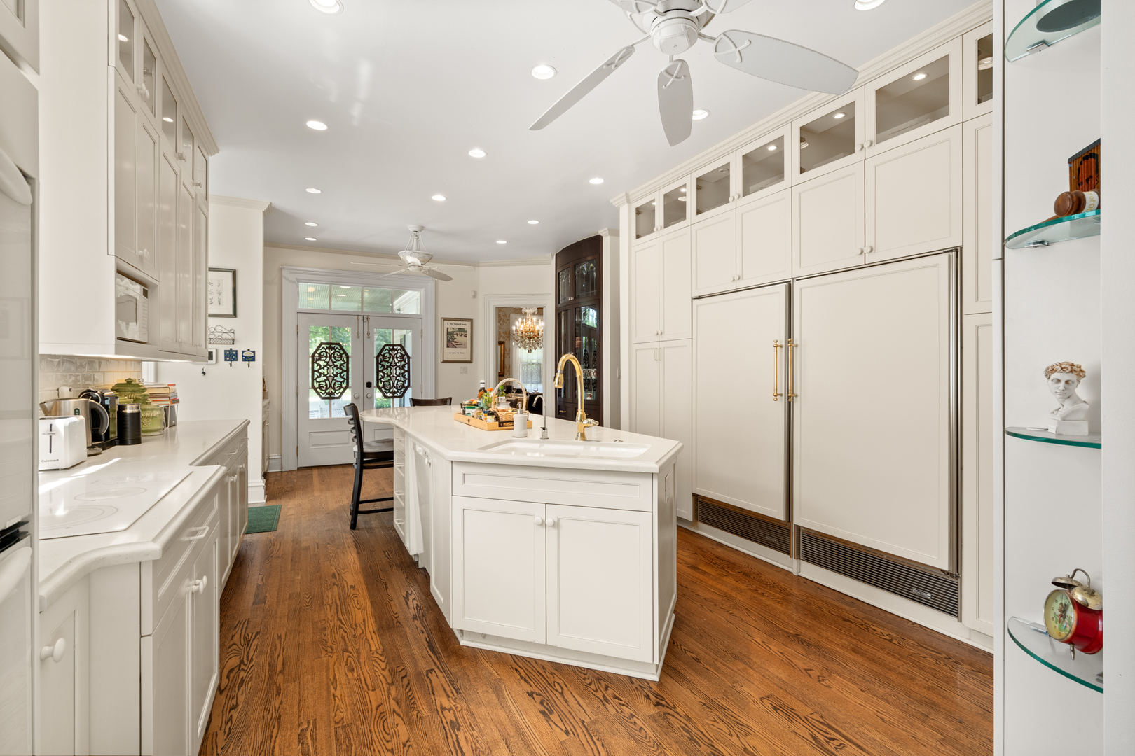 201 Scottswood Road Riverside, IL 60546 - Photo 19 of 32 a large white kitchen with stainless steel appliances a refrigerator a stove a sink dishwasher and a oven with wooden floor