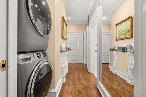 a view of a bedroom with washer and dryer