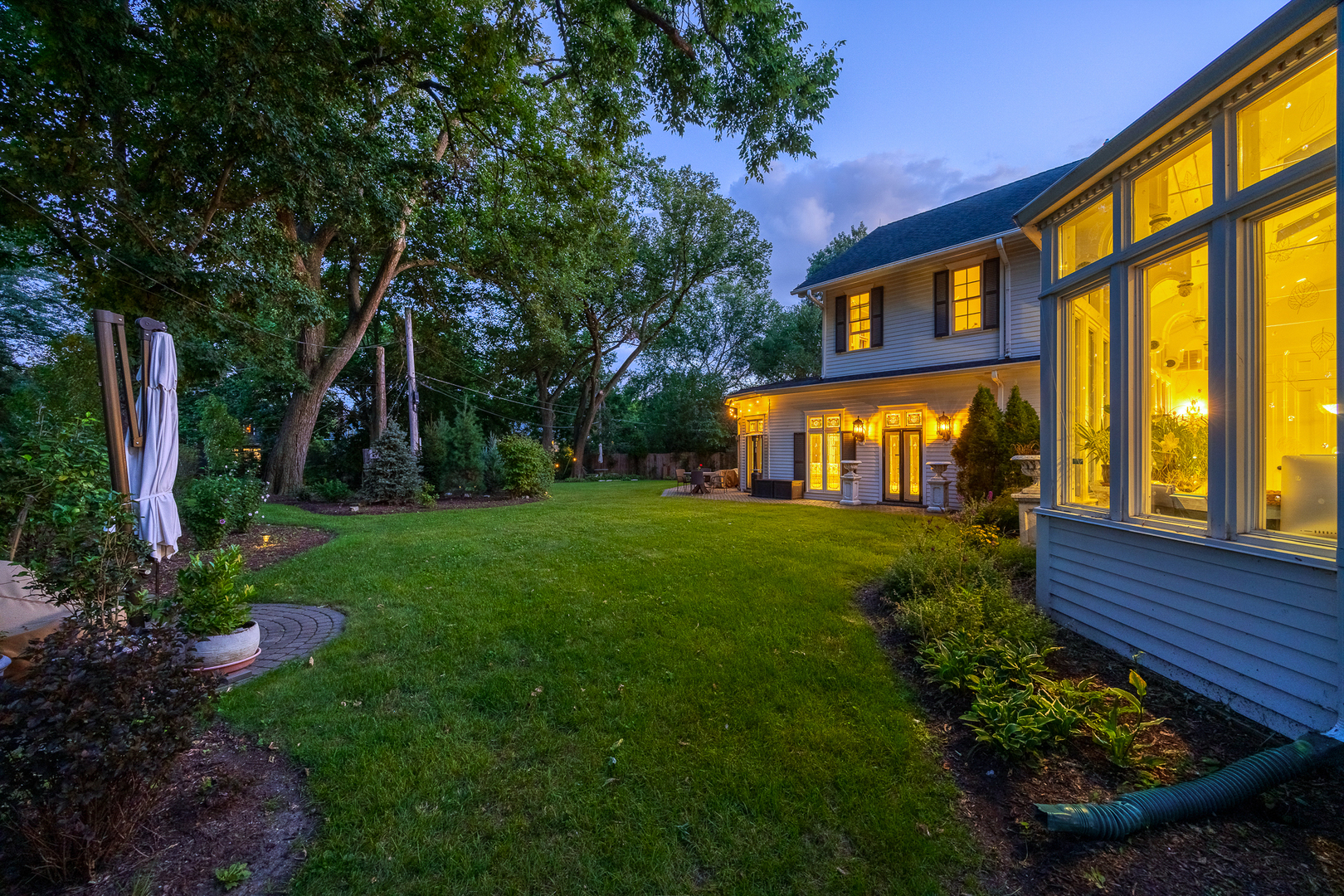 201 Scottswood Road Riverside, IL 60546 - Photo 10 of 32 a front view of a house with garden