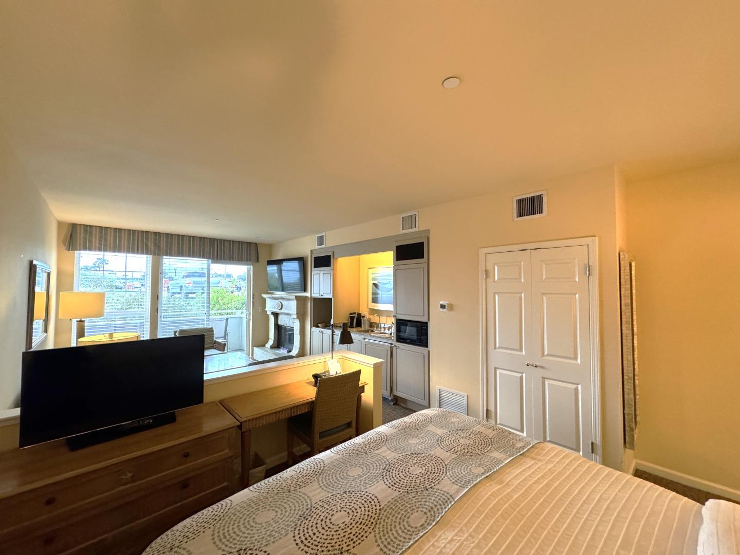 4100 Cabrillo Highway, Unit 105 Half Moon Bay, CA 94019 - Photo 4 of 19 a bedroom with two beds and large windows