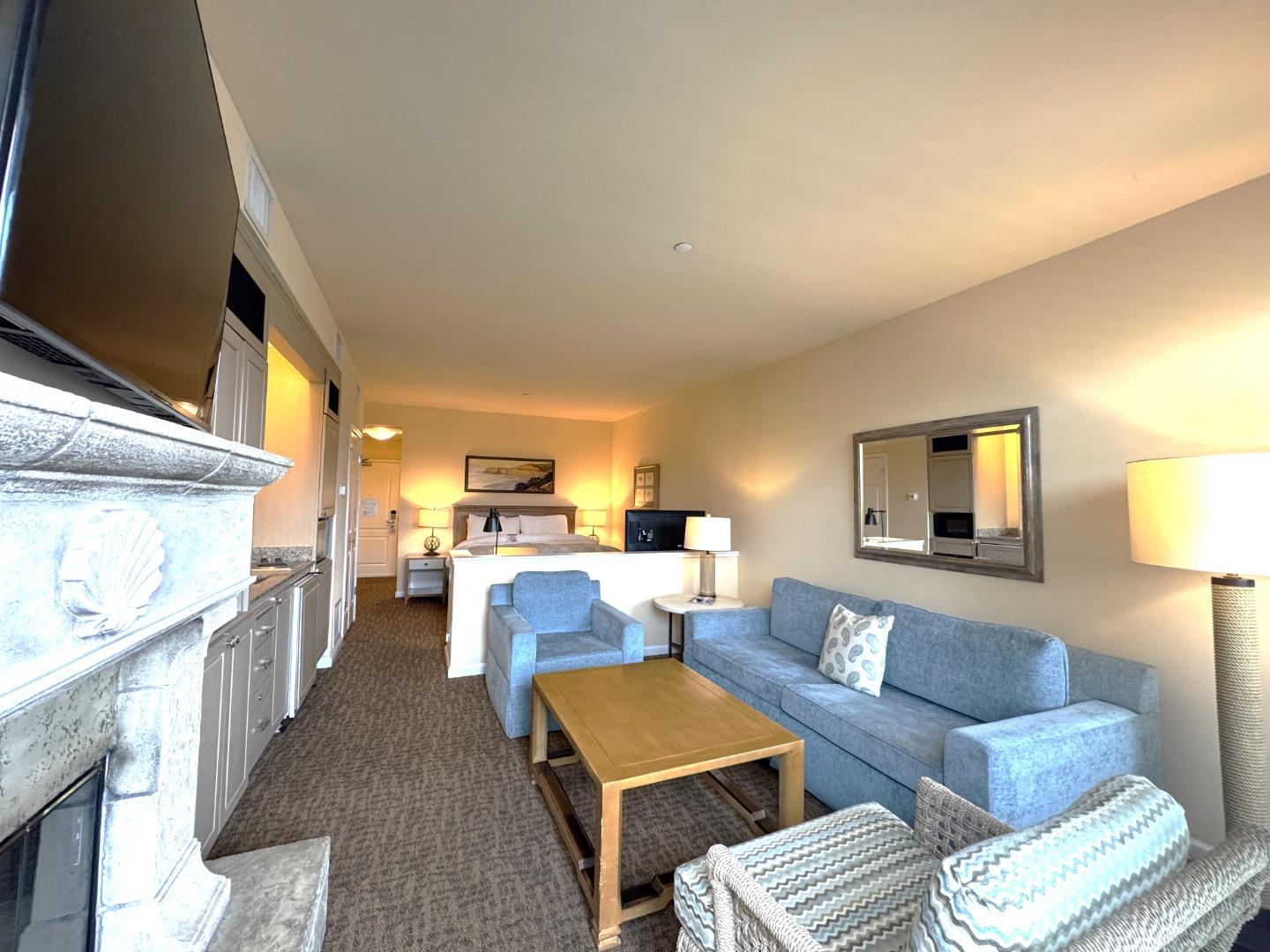 4100 Cabrillo Highway, Unit 105 Half Moon Bay, CA 94019 - Photo 6 of 19 a living room with furniture and a lamp