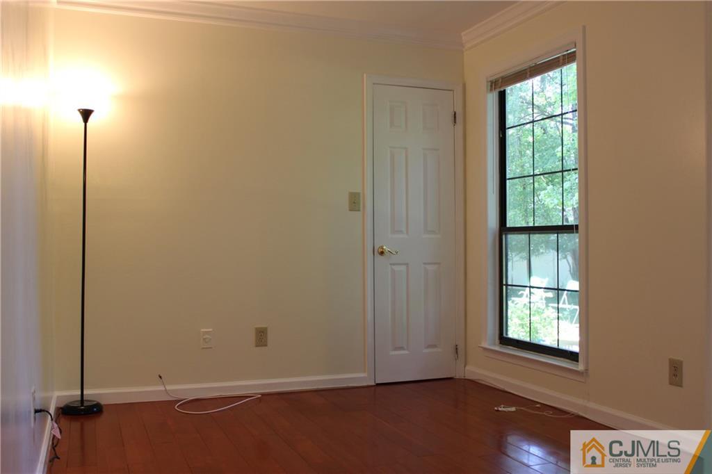 1706 Timber Oaks Road, Unit 1706 Edison, NJ 08820 - Photo 18 of 25 an empty room with windows