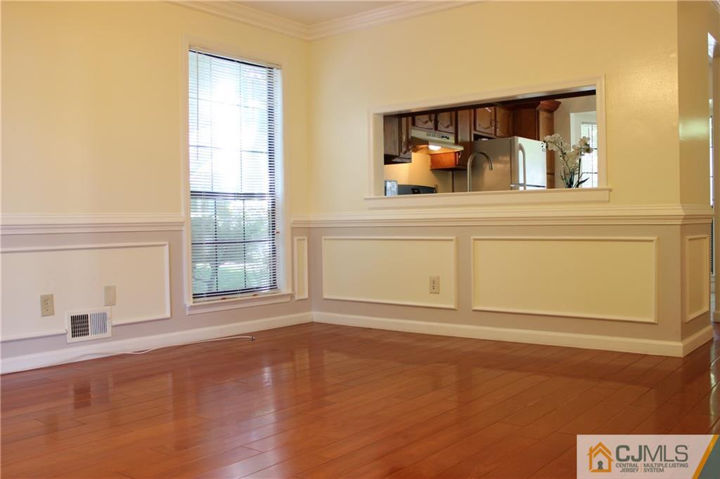 1706 Timber Oaks Road, Unit 1706 Edison, NJ 08820 - Photo 7 of 25 a view of a bedroom with wooden floor and cabinet