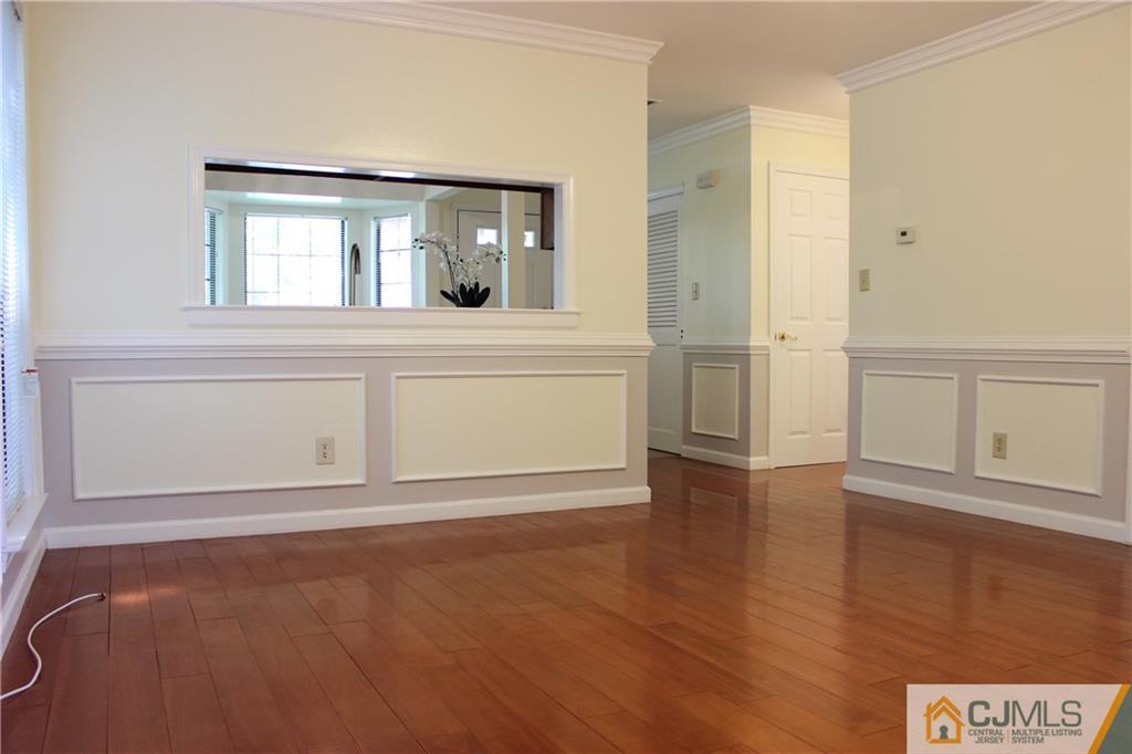 1706 Timber Oaks Road, Unit 1706 Edison, NJ 08820 - Photo 8 of 25 wooden floor in an empty room