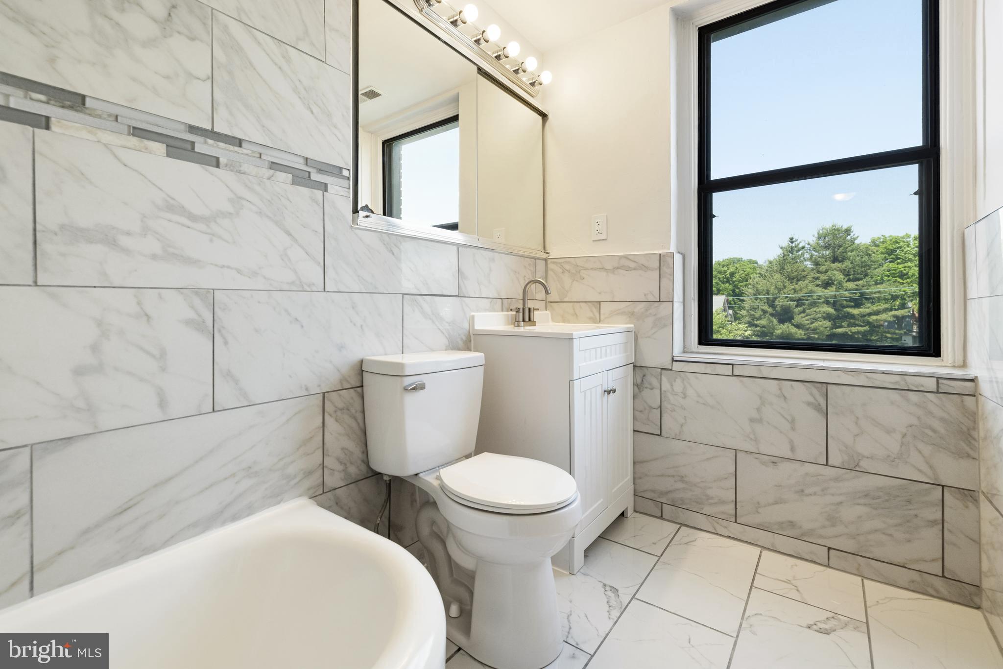 900 Valley Road, Unit A202 Melrose Park, PA 19027 - Photo 21 of 29 Updated hall bath