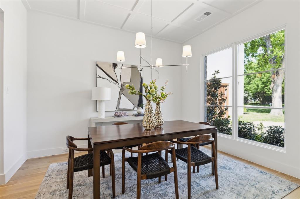 7611 Caillet Street Dallas, TX 75209 - Photo 11 of 37 a view of a dining room with furniture window and wooden floor