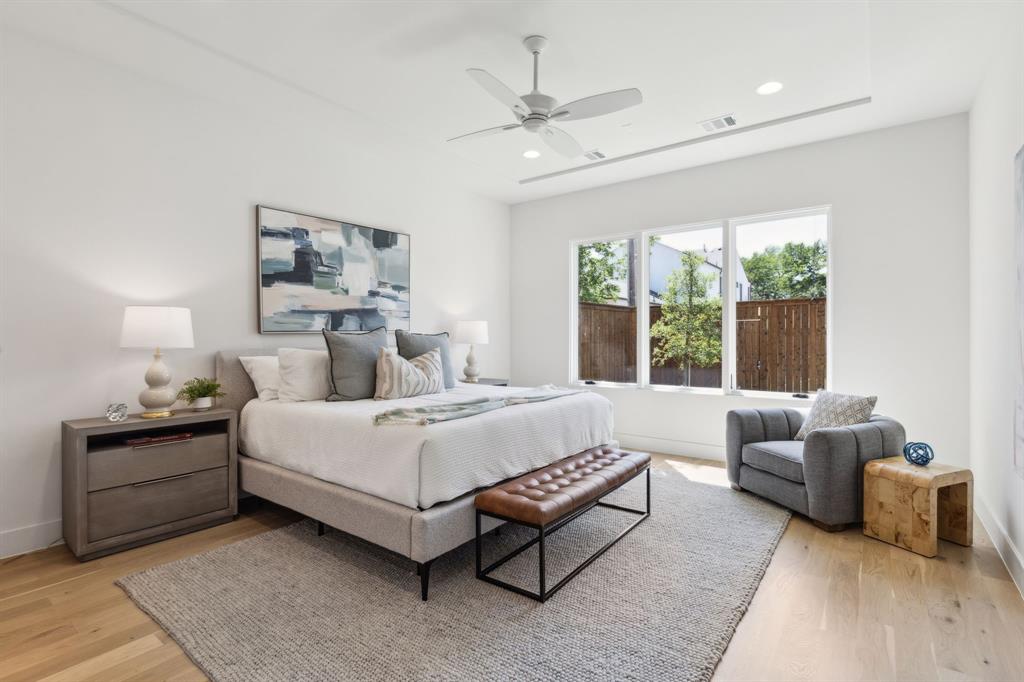 7611 Caillet Street Dallas, TX 75209 - Photo 17 of 37 a bed room with a bed and a couch