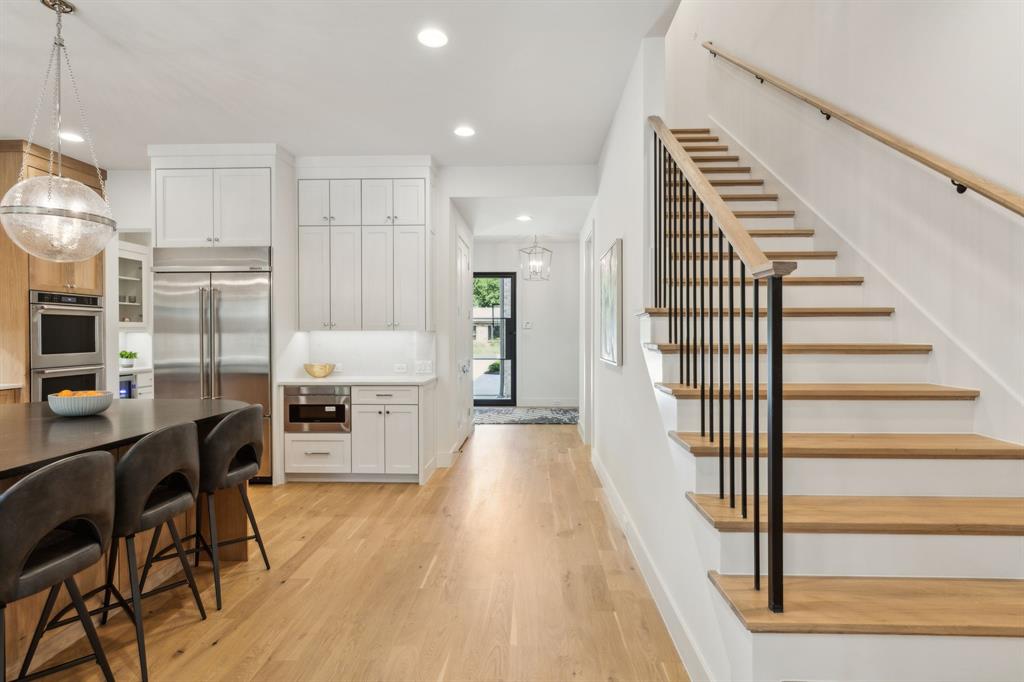 7611 Caillet Street Dallas, TX 75209 - Photo 25 of 37 a view of a kitchen with cabinets and wooden floor