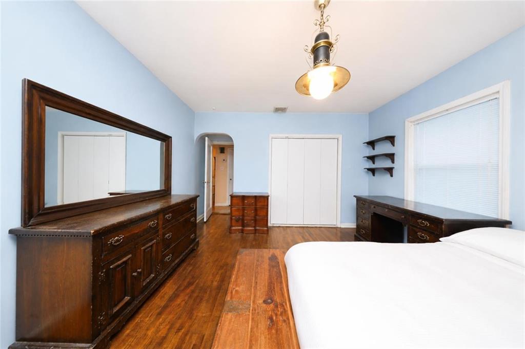 1 Bay Ridge Parkway Brooklyn, NY 11209 - Photo 22 of 38 a bedroom with a bed and a flat tv screen on dresser