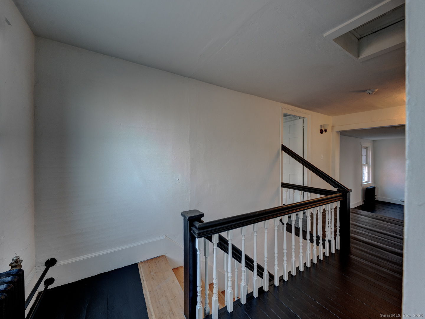 668 Middle Turnpike Mansfield, CT 06268 - Photo 17 of 40 a view of staircase with railing and white walls