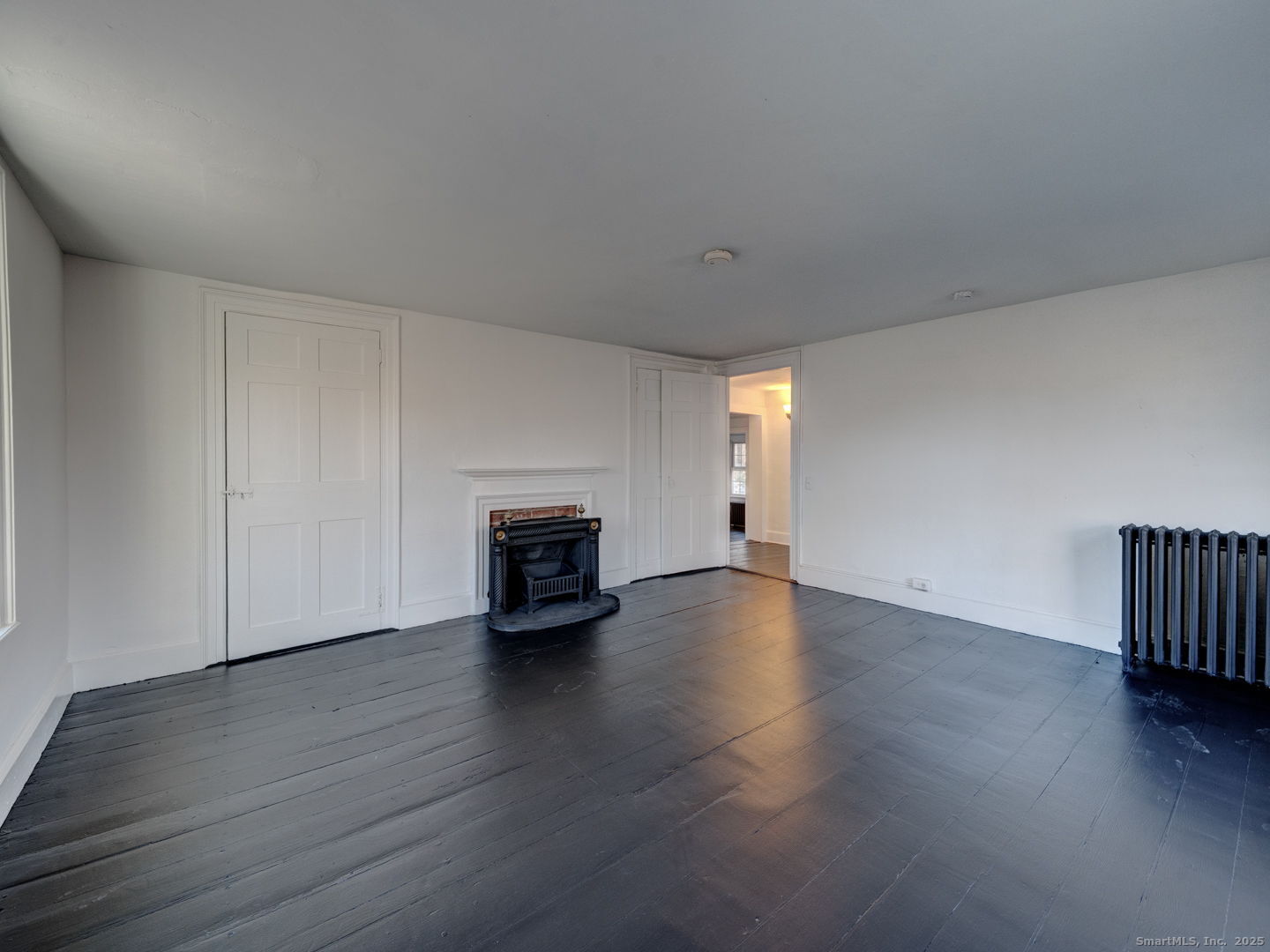 668 Middle Turnpike Mansfield, CT 06268 - Photo 20 of 40 a view of an empty room with wooden floor and a window