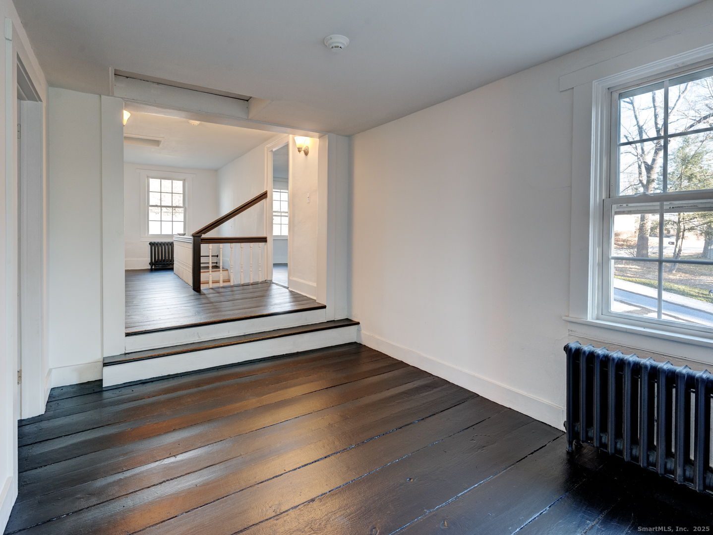668 Middle Turnpike Mansfield, CT 06268 - Photo 26 of 40 a view of entryway and hall with wooden floor