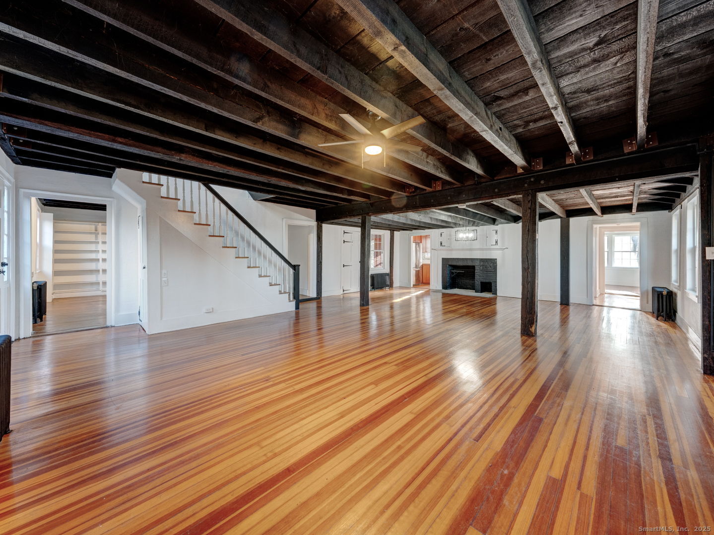 668 Middle Turnpike Mansfield, CT 06268 - Photo 6 of 40 a view of an empty room with wooden floor