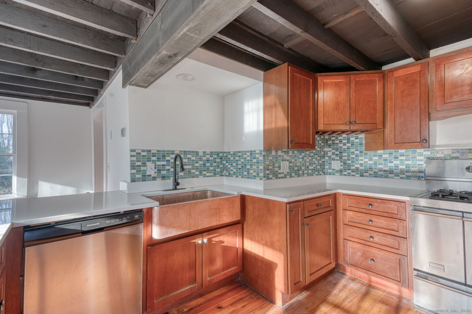 668 Middle Turnpike Mansfield, CT 06268 - Photo 7 of 40 a kitchen with stainless steel appliances granite countertop a sink and cabinets