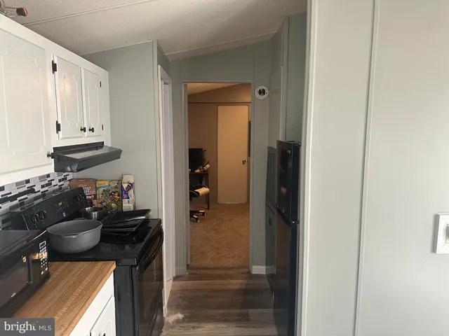 a view of a entryway and storage and utility room