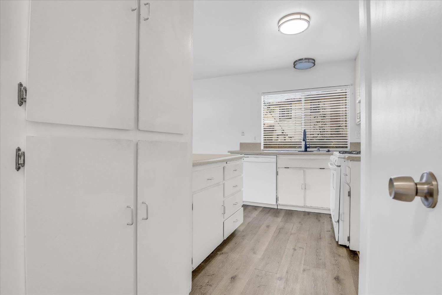 2200 Kimwood Lane Rancho Cordova, CA 95670 - Photo 11 of 26 a kitchen with white cabinets and white appliances