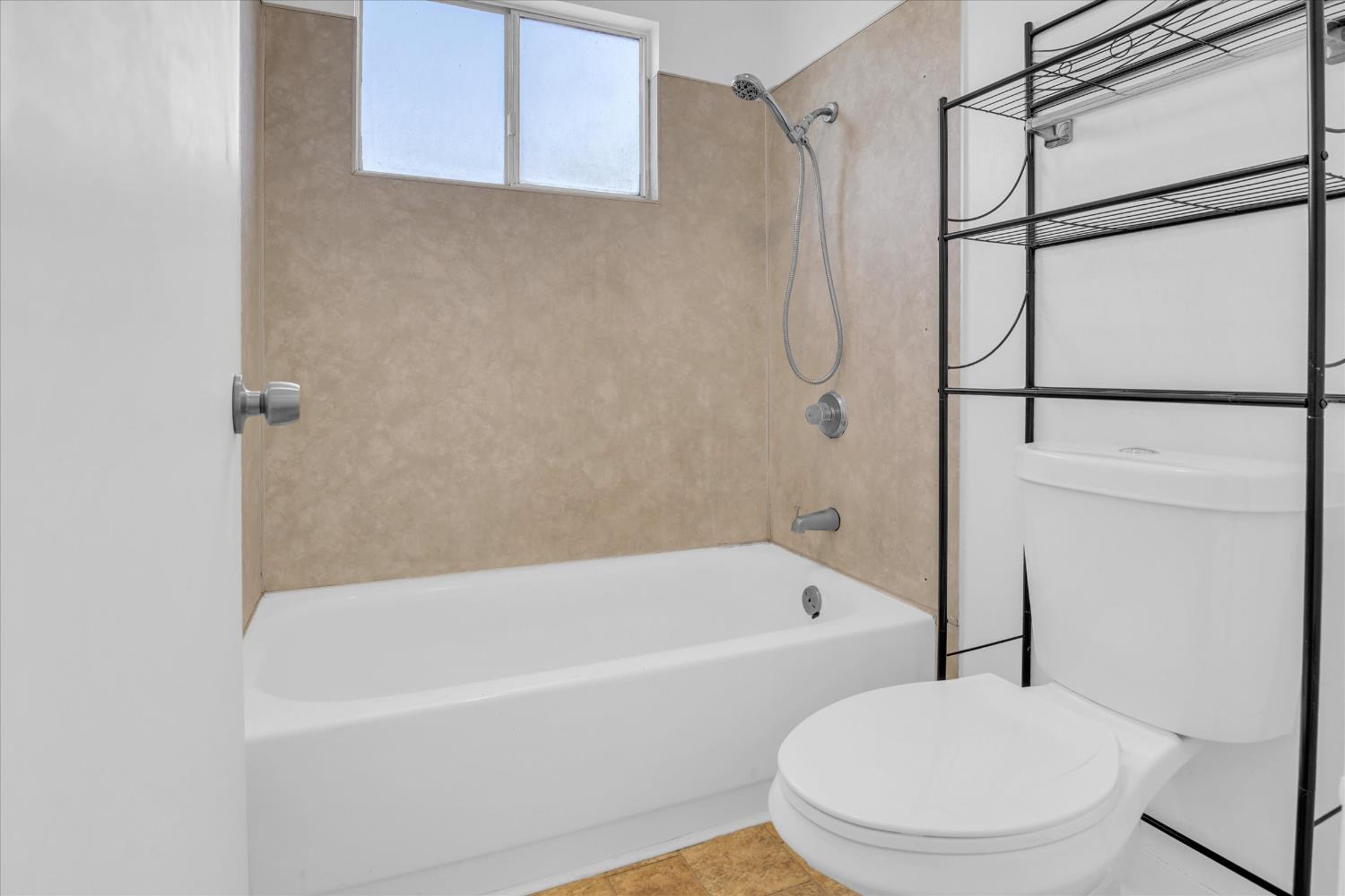 2200 Kimwood Lane Rancho Cordova, CA 95670 - Photo 19 of 26 a white bath tub sitting next to a white toilet and sink