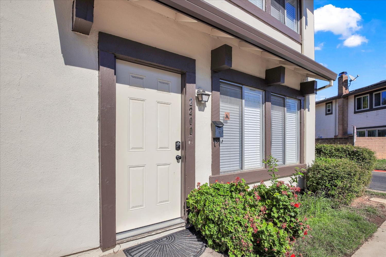2200 Kimwood Lane Rancho Cordova, CA 95670 - Photo 2 of 26 a view of a house with a flower garden