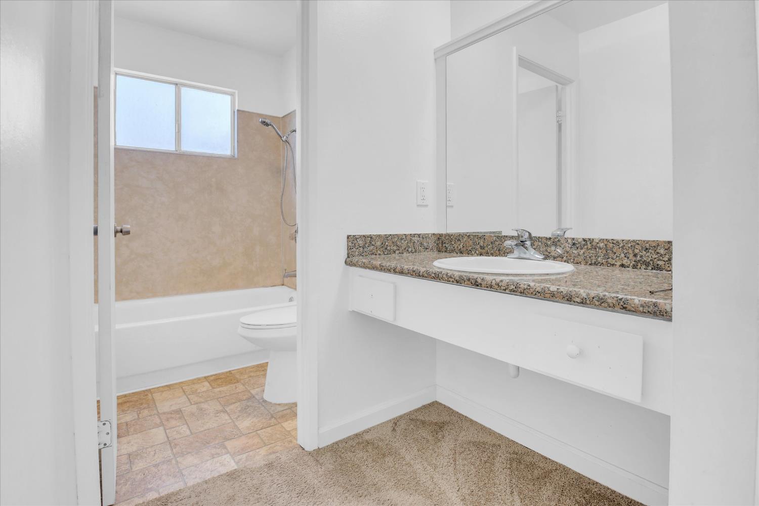 2200 Kimwood Lane Rancho Cordova, CA 95670 - Photo 23 of 26 a bathroom with a granite countertop sink and a mirror