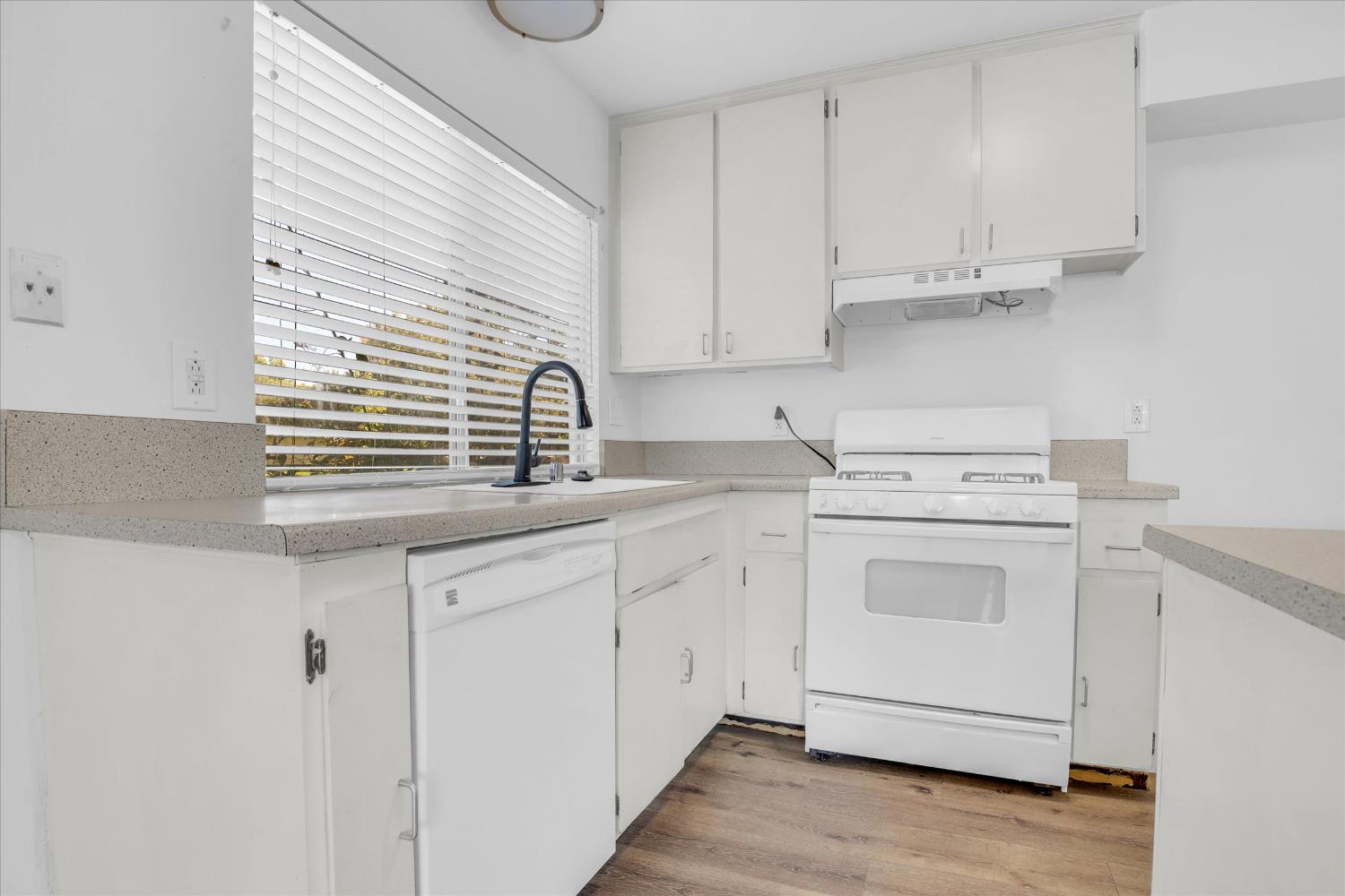 2200 Kimwood Lane Rancho Cordova, CA 95670 - Photo 10 of 26 a kitchen with white cabinets and white appliances