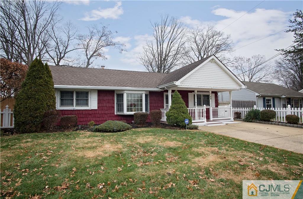 52 Idlewild Road Edison, NJ 08817 - Photo 3 of 21 a front view of a house with a garden and trees