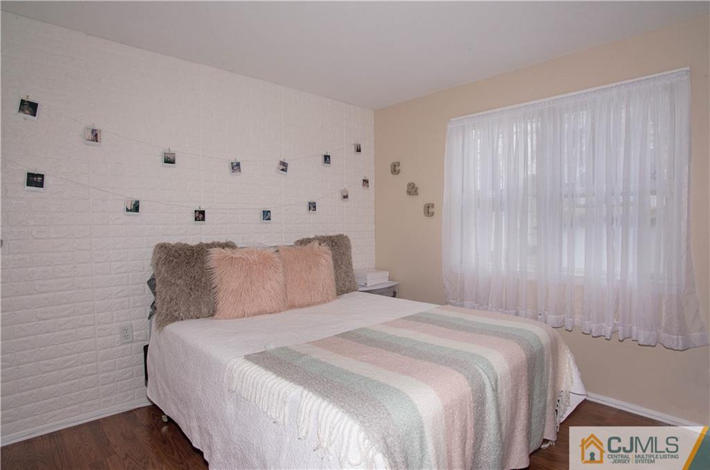 52 Idlewild Road Edison, NJ 08817 - Photo 4 of 21 a bedroom with a bed and a window