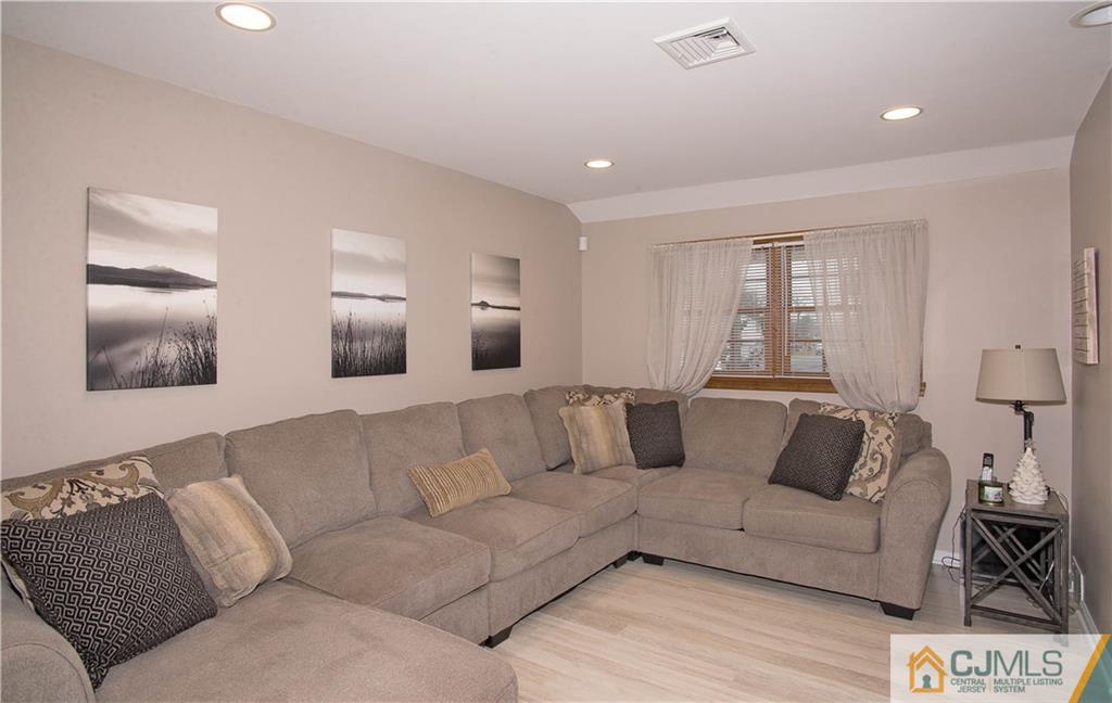 52 Idlewild Road Edison, NJ 08817 - Photo 5 of 21 a living room with furniture and a couch
