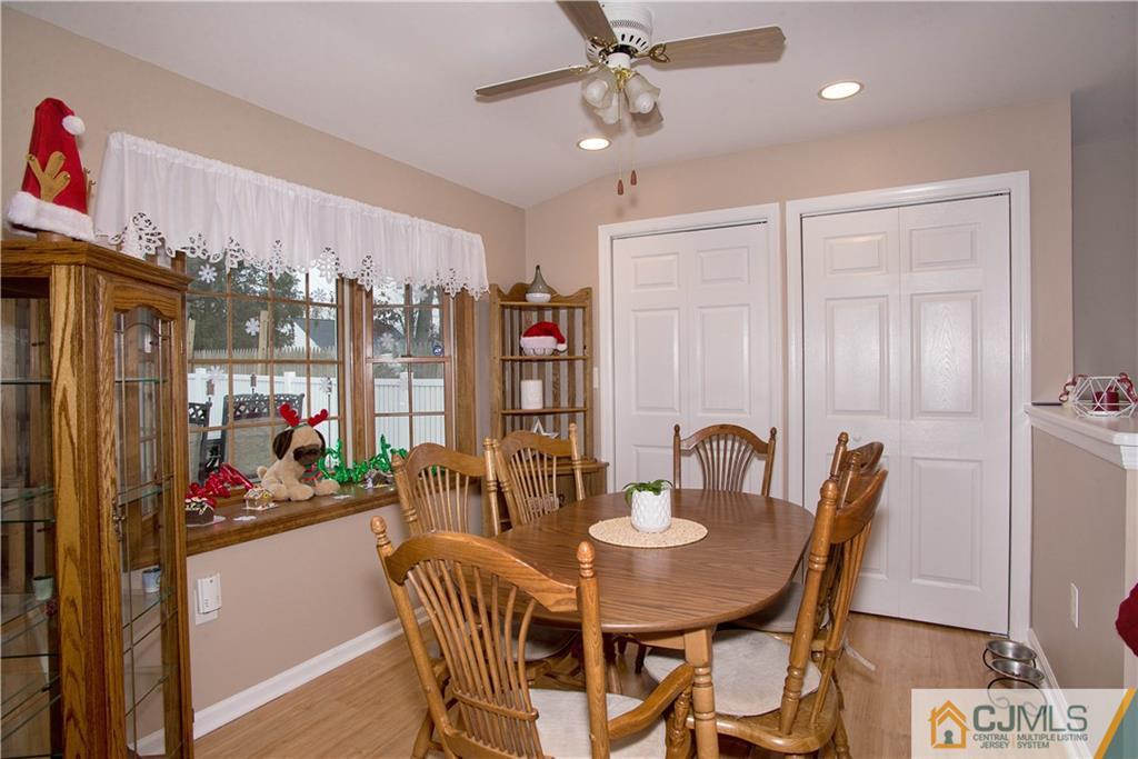 52 Idlewild Road Edison, NJ 08817 - Photo 7 of 21 a view of a dining room with furniture and chandelier