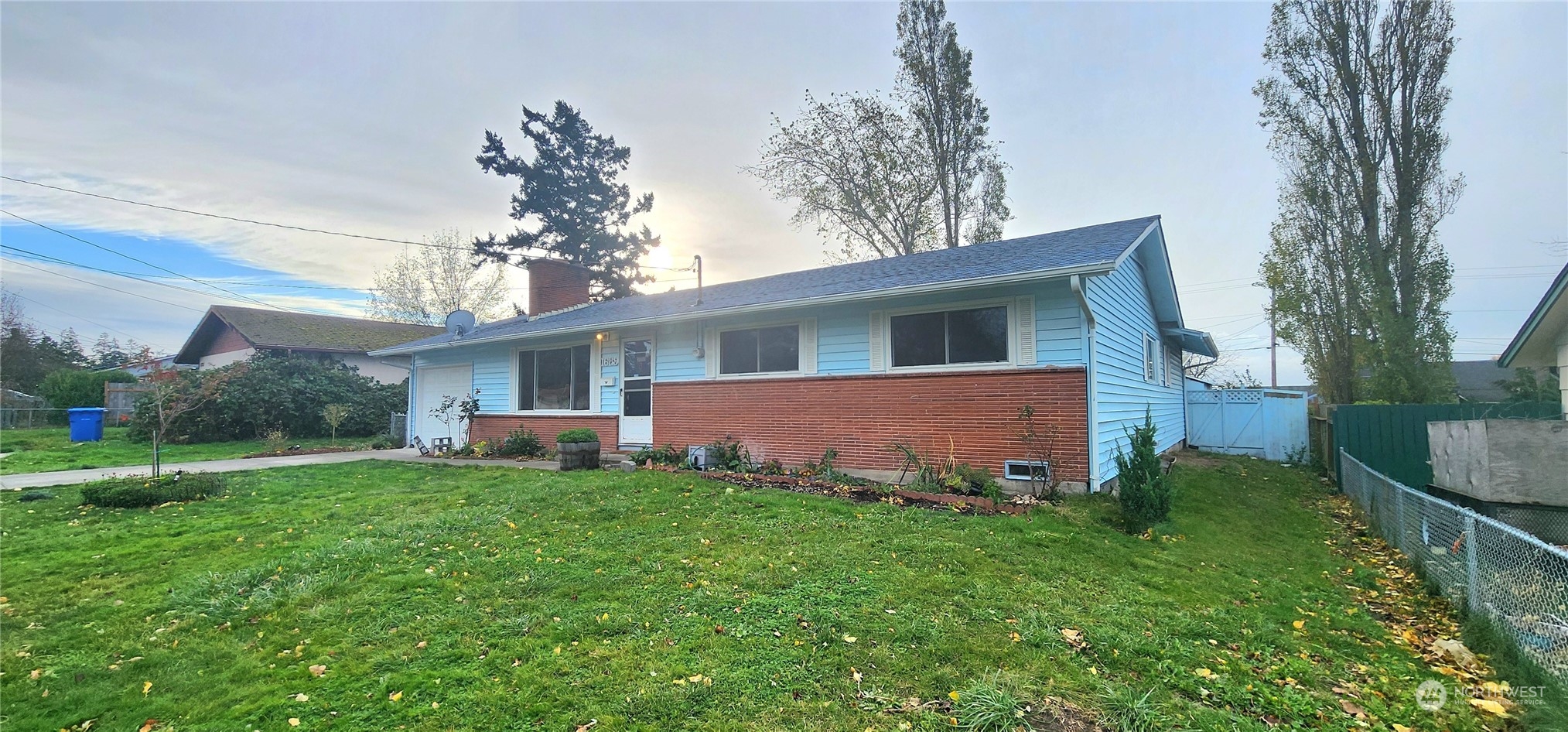 1689 Northeast 1st Avenue Oak Harbor, WA 98277 - Photo 1 of 26 a view of a house with a yard and sitting area