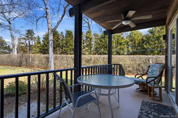 a view of a patio with a table chairs and a table