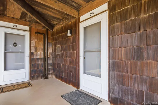 a bathroom with a shower and a sink
