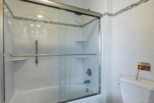 a bathroom with a shower and a toilet