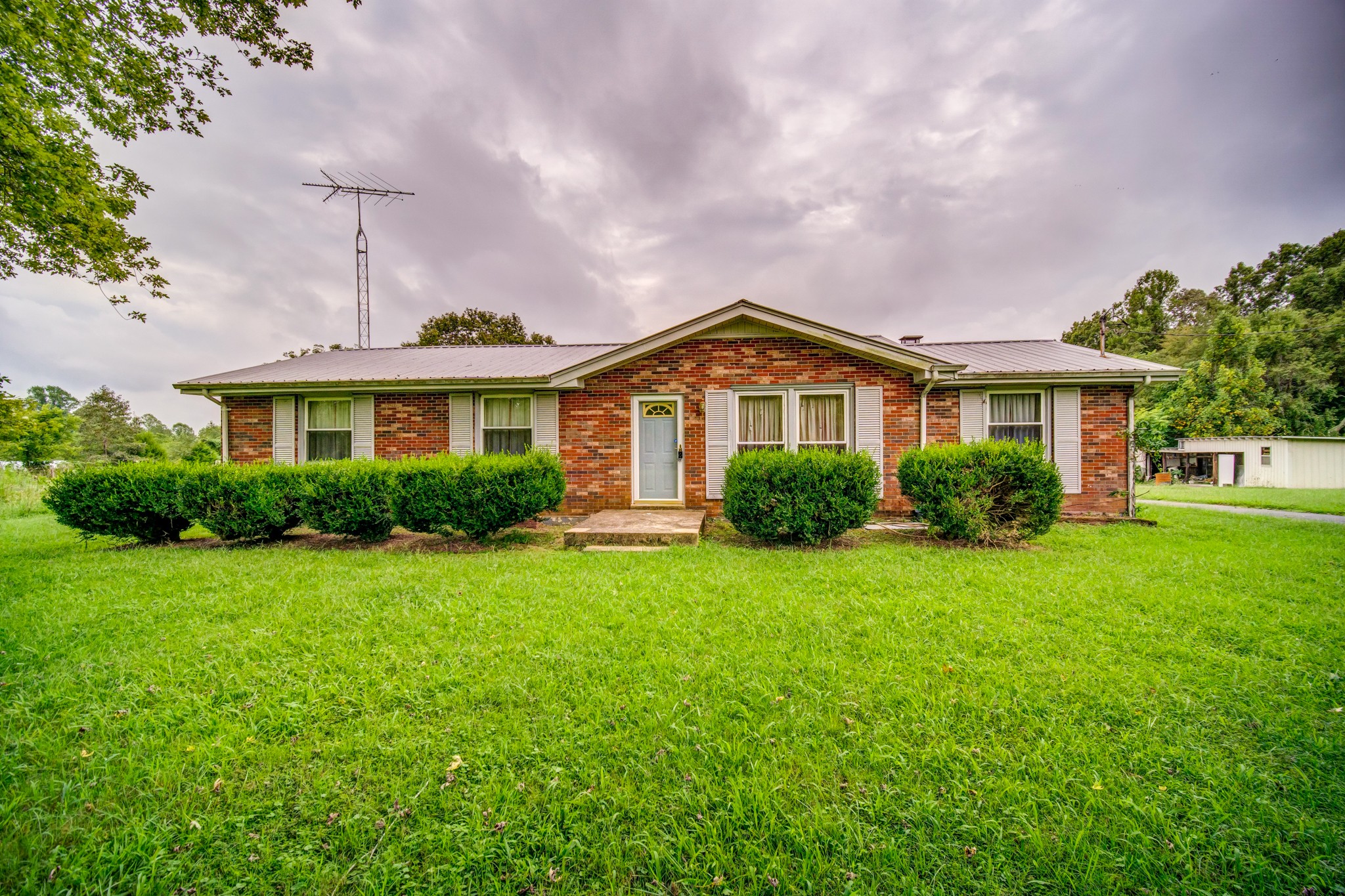 1377 Deal Road Burns, TN 37029 - Photo 1 of 47 a front view of a house with a yard