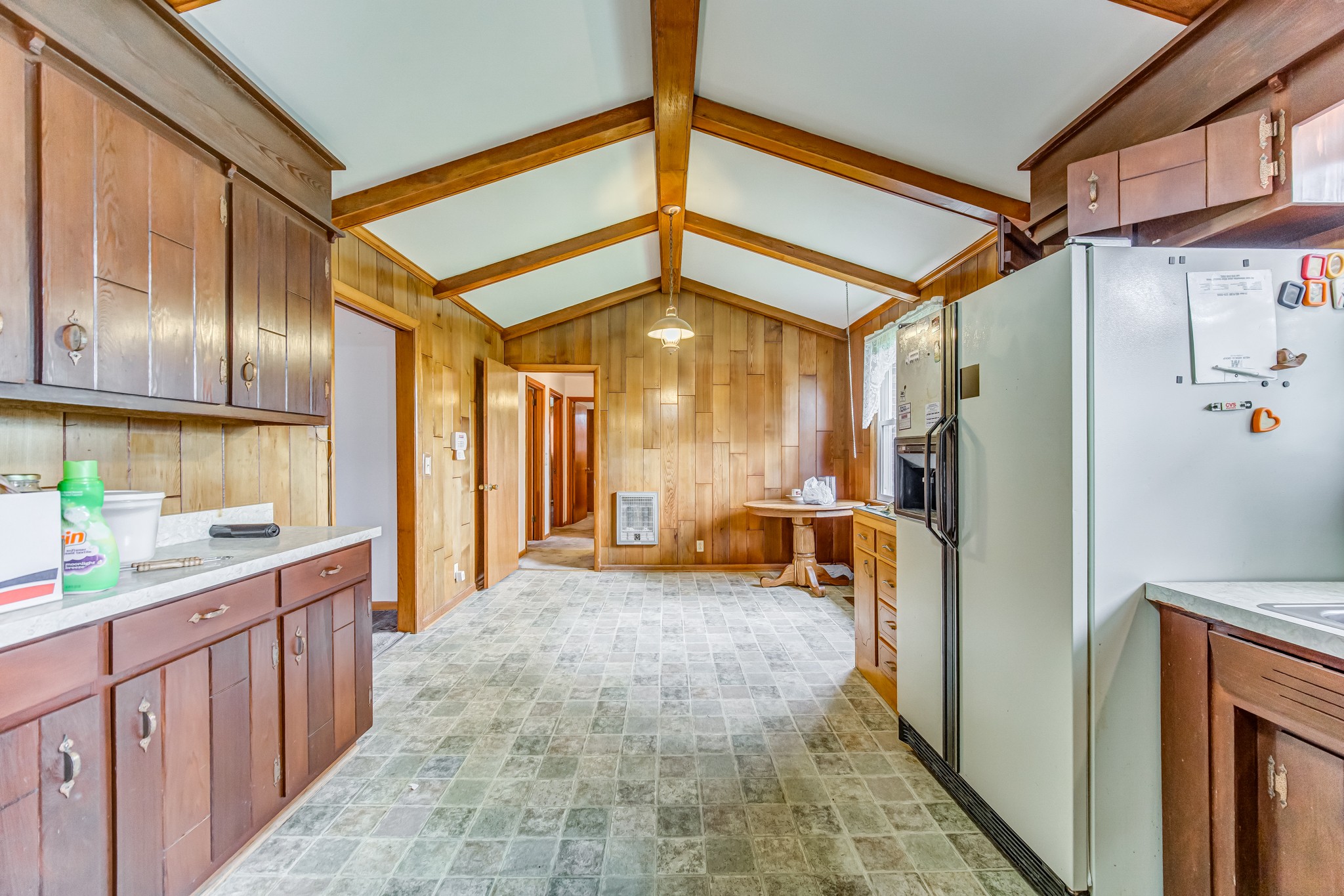 1377 Deal Road Burns, TN 37029 - Photo 18 of 47 a view of a hallway with a dining table chairs and a refrigerator