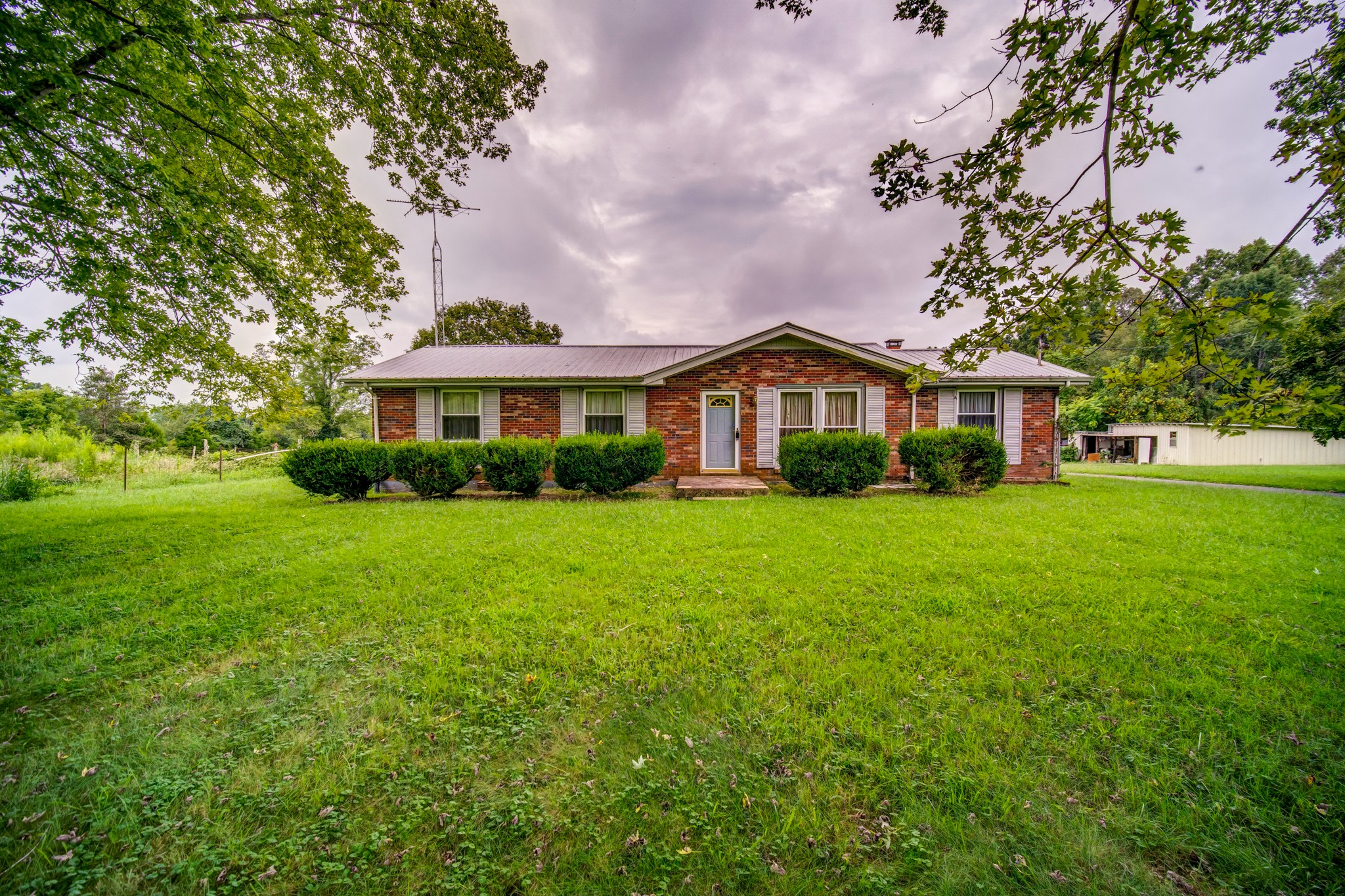 1377 Deal Road Burns, TN 37029 - Photo 2 of 47 a front view of a house with a yard