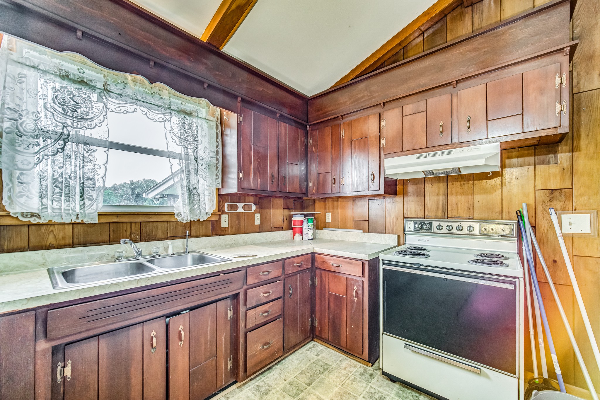 1377 Deal Road Burns, TN 37029 - Photo 21 of 47 a kitchen with a sink stove and cabinets
